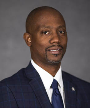 Commissioner Lumon J May